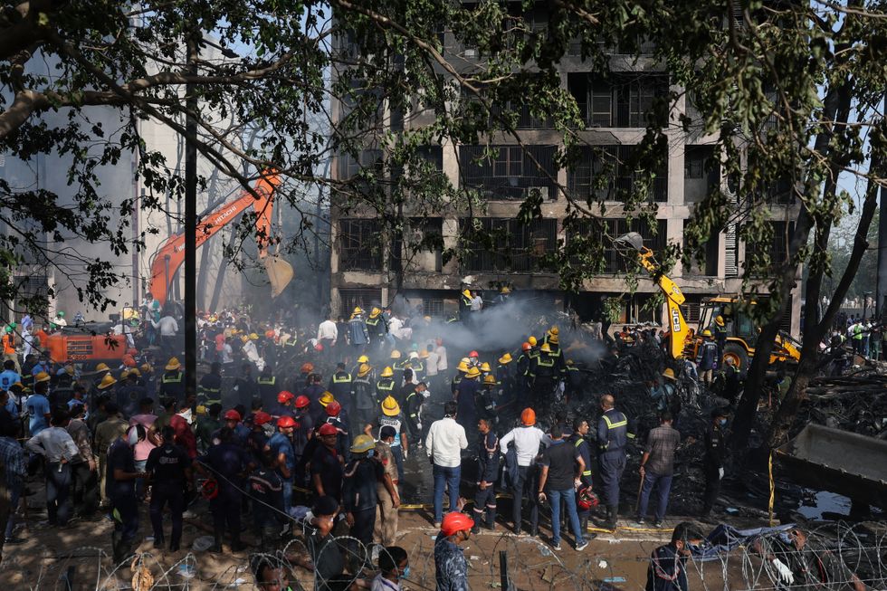 \u200bRescue workers work at the scene of the crash