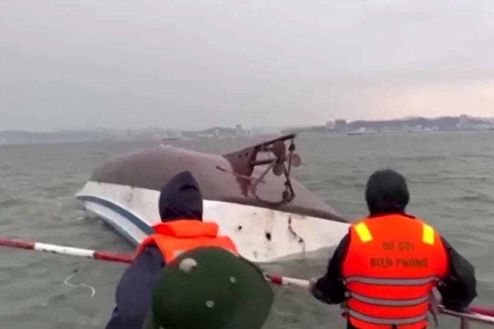 \u200bRescuers at the scene of the capzised vessel