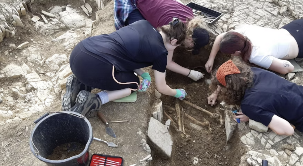 \u200bResearchers working at the scene in the grounds of Fonmon Castle