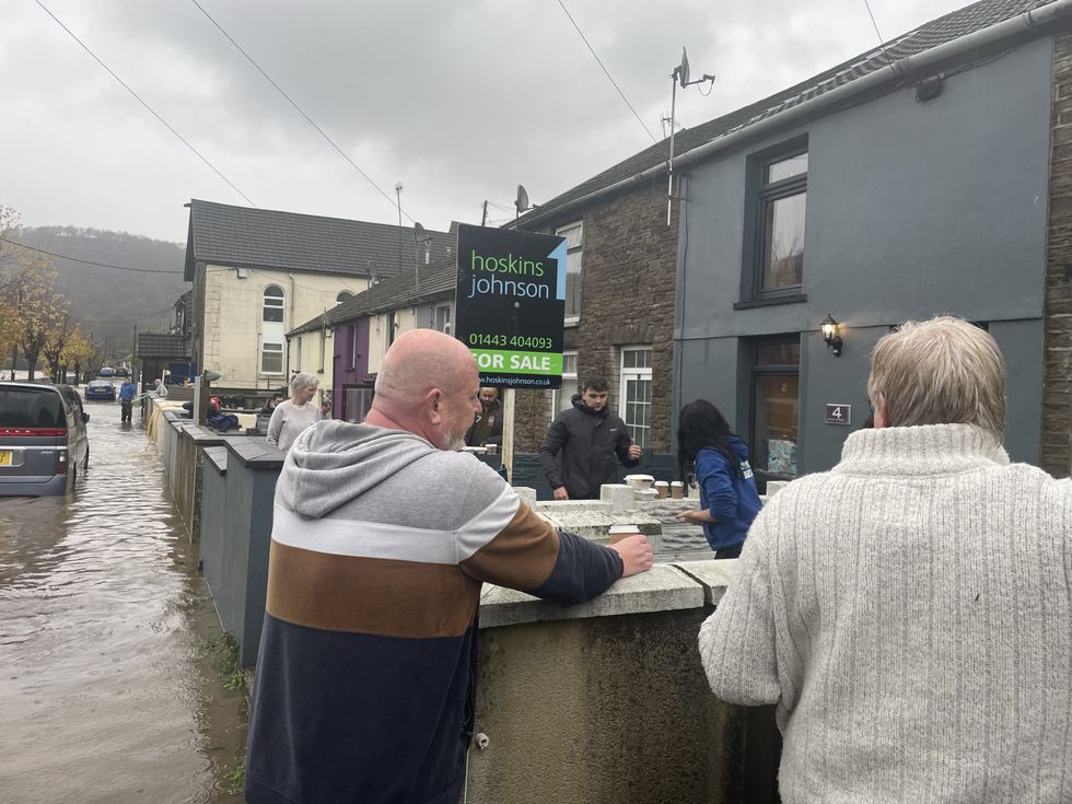 \u200bResidents attend to their properties on Sion Street in Pontypridd