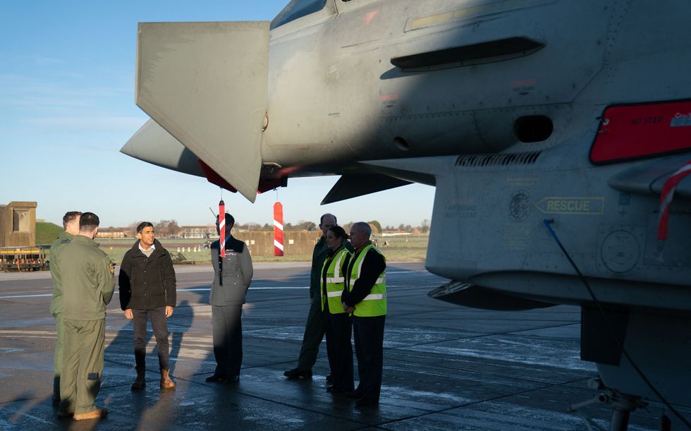 \u200bRishi Sunak visits Royal Air Force RAF Coningsby, near Lincoln, following the announcement that Britain will work to develop next-generation fighter jets with Italy and Japan