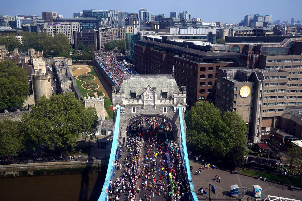 \u200bRunners cross Tower Bridge in the 2025 London Marathon