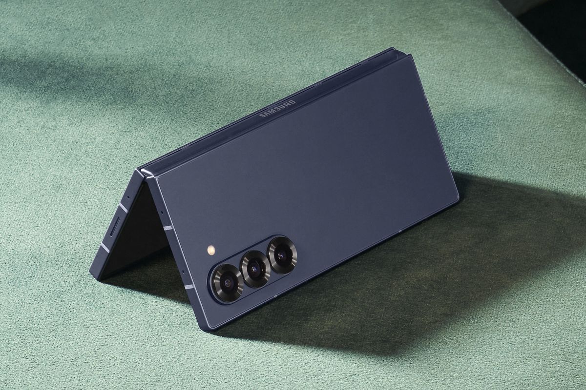 \u200bSamsung Galaxy Z Fold 6 pictured in Navy resting open on a couch