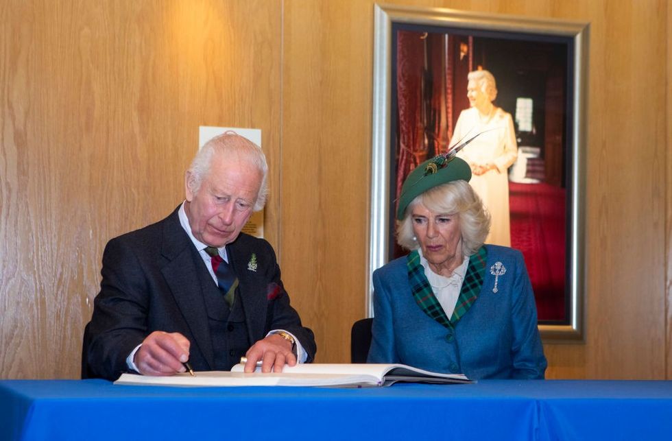 \u200bScottish Parliament, King Charles III and Queen Camilla sign the Visitors\u2019 Book at the Scottish Parliament