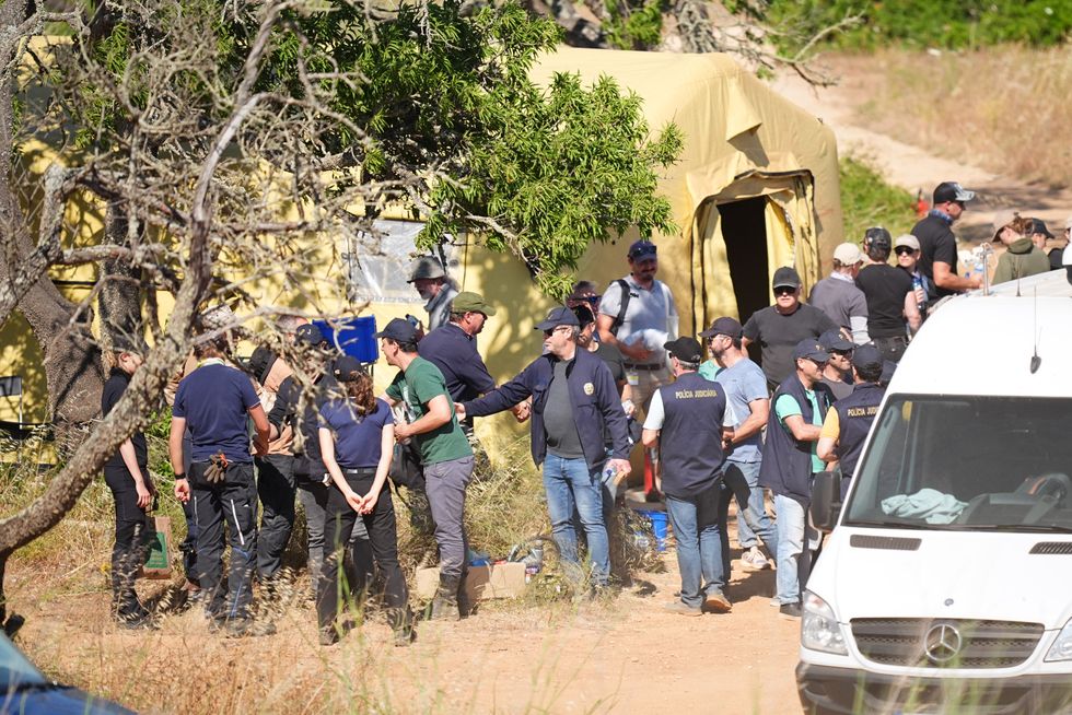 \u200bSearchers stood in a circle and were seen celebrating the end of the latest search