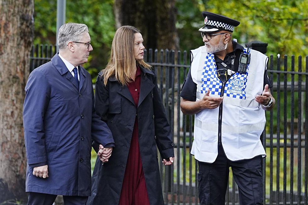 \u200bSir Keir with Lady Starmer walking to the vigil