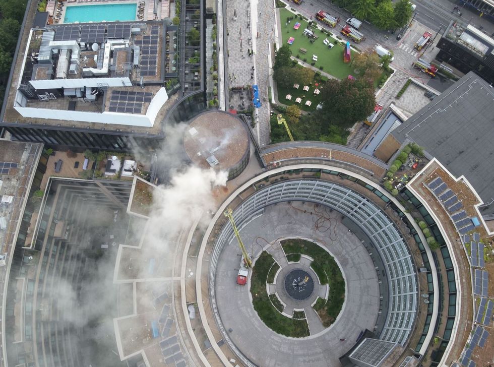 \u200bSmoke can be seen rising out of the building