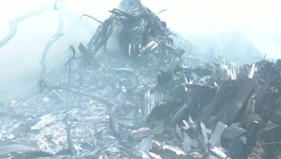 \u200bSmoke rises amidst debris after an Air India plane crashed in Ahmedabad, India