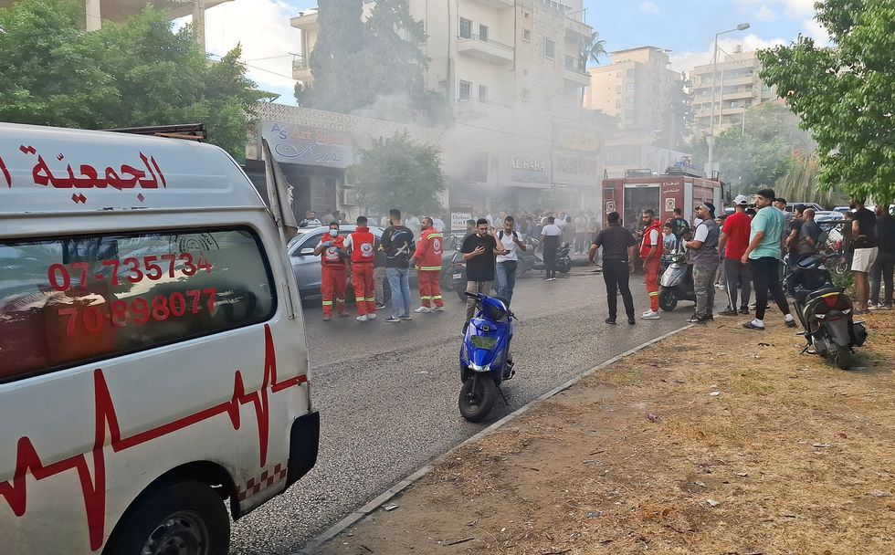 \u200bSmoke rises from a mobile shop in Sidon, Lebanon