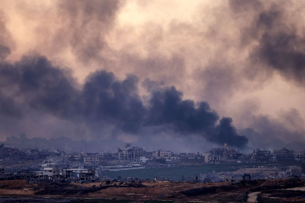 \u200bSmoke rising above destroyed buildings in the northern Gaza Strip during an Israeli army bombardment