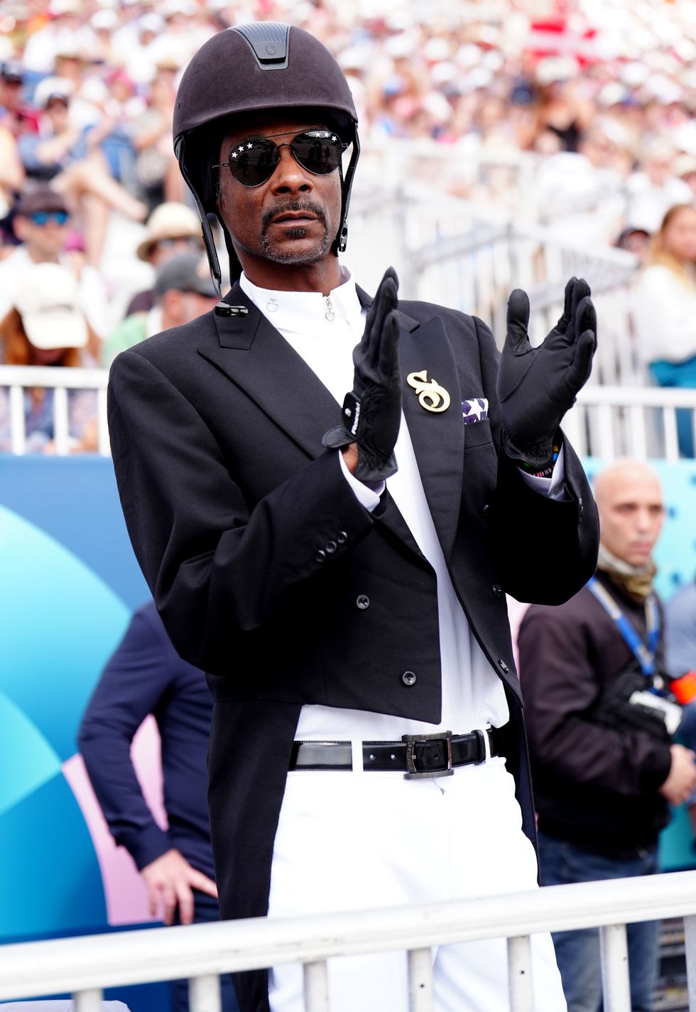 \u200bSnoop Dogg watching the Dressage Team Grand Prix Special at the Chateau de Versailles on the eighth day of the 2024 Paris Olympic Games in France