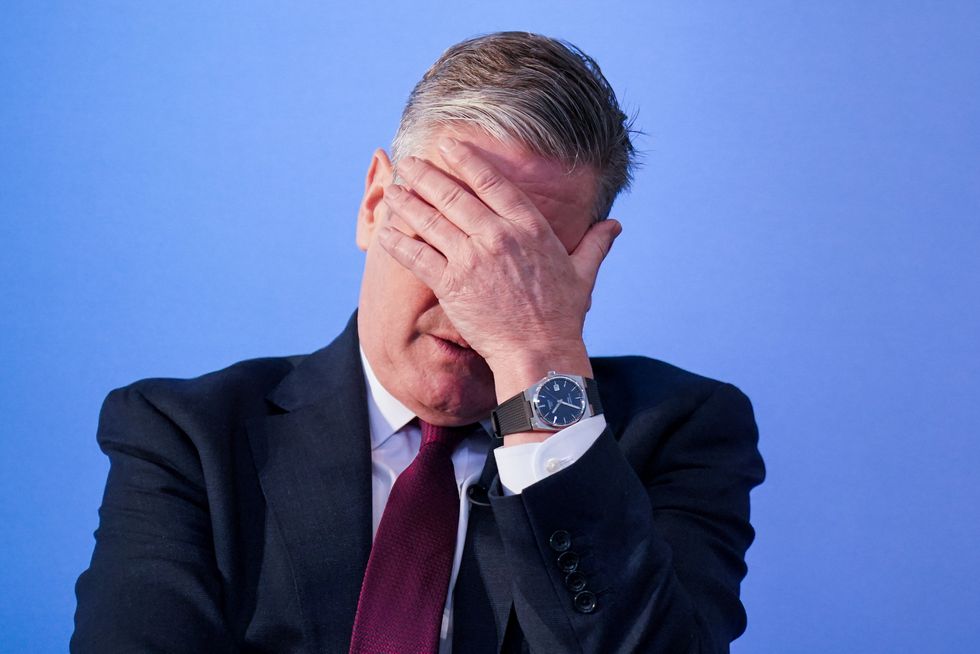 \u200bStarmer holds his head in his hands