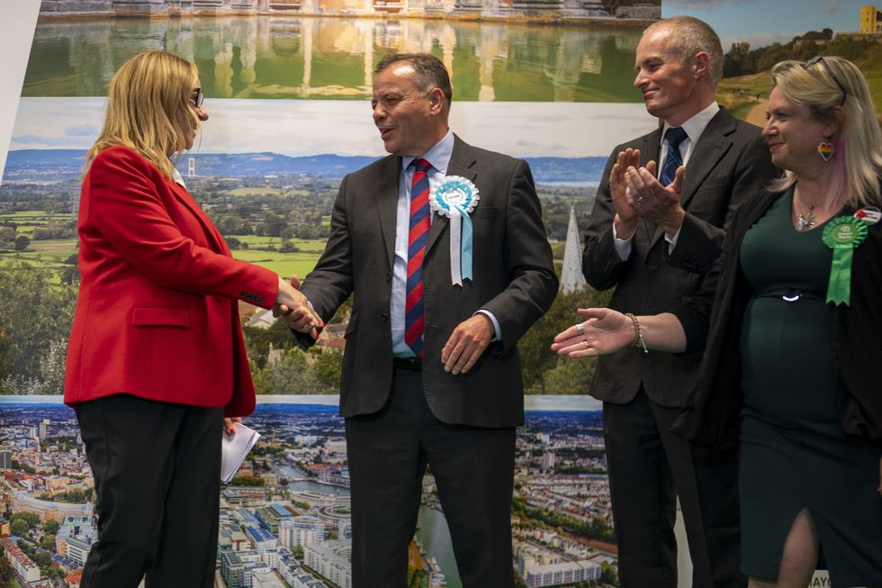 \u200bSuccessful Labour Party candidate Helen Godwin shakes Arron Banks hand