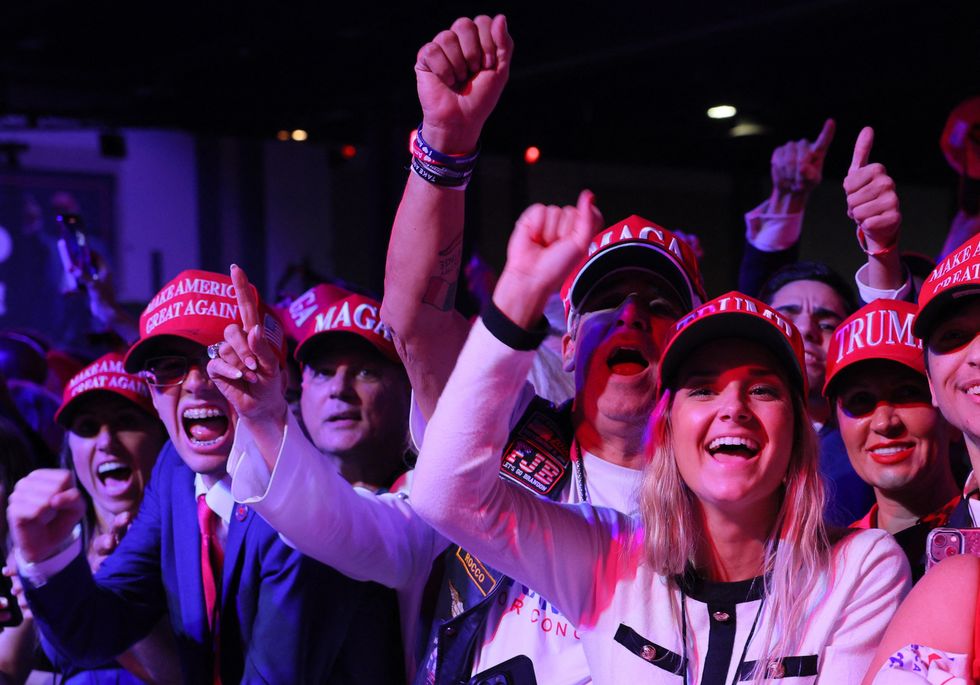 \u200bSupporters of Donald Trump react at the site of his rally, at the Palm Beach County Convention Center in West Palm Beach