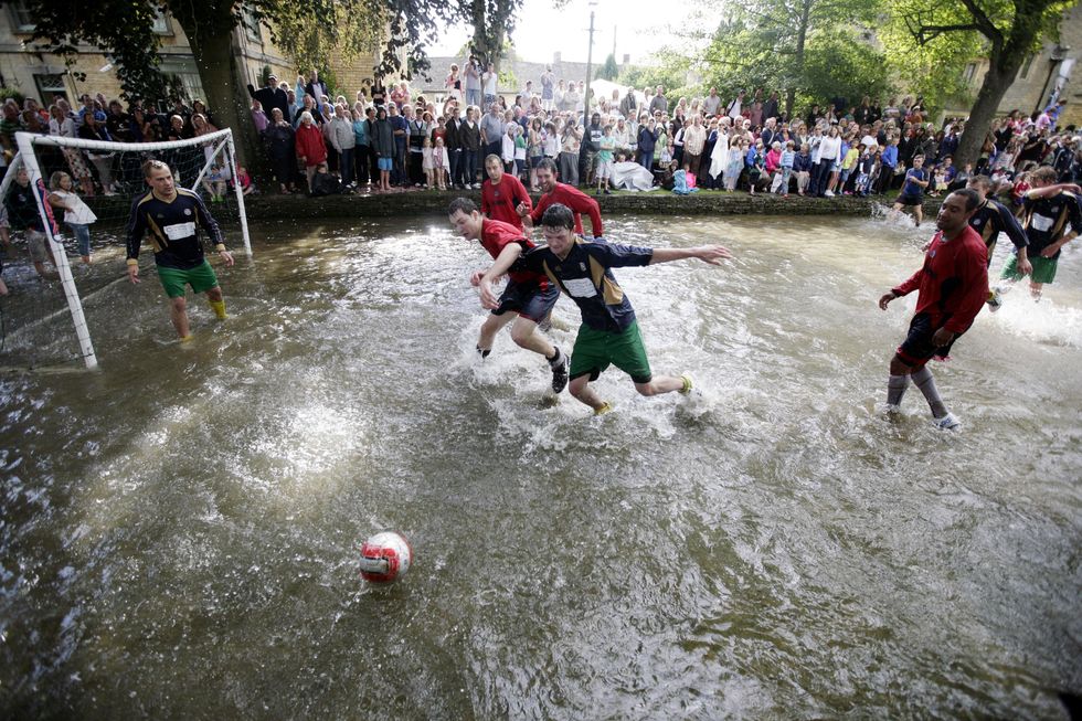 \u200bThe annual river football match in the River Windrush