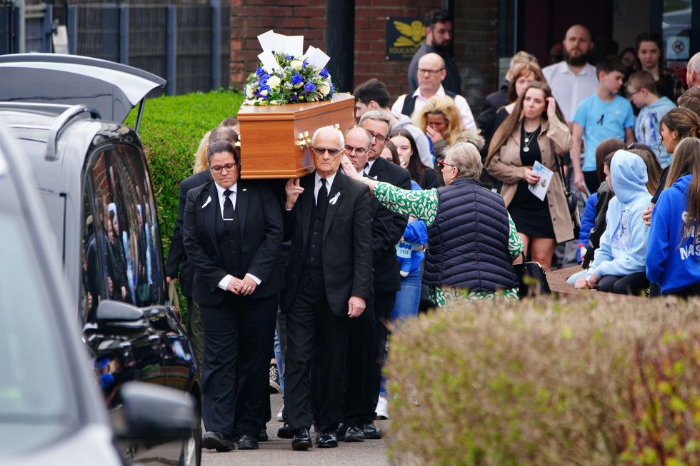\u200bThe coffin of 16-year-old Max Dixon is carried out of Imperial Sports Ground in Brislington