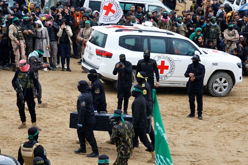\u200bThe coffins are handed back to the red cross