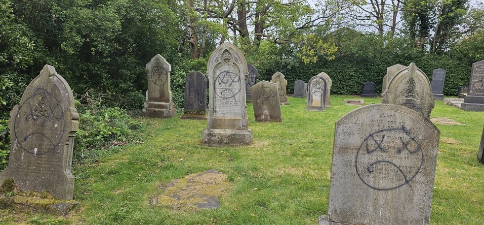 \u200bThe gravestones marked with graffiti