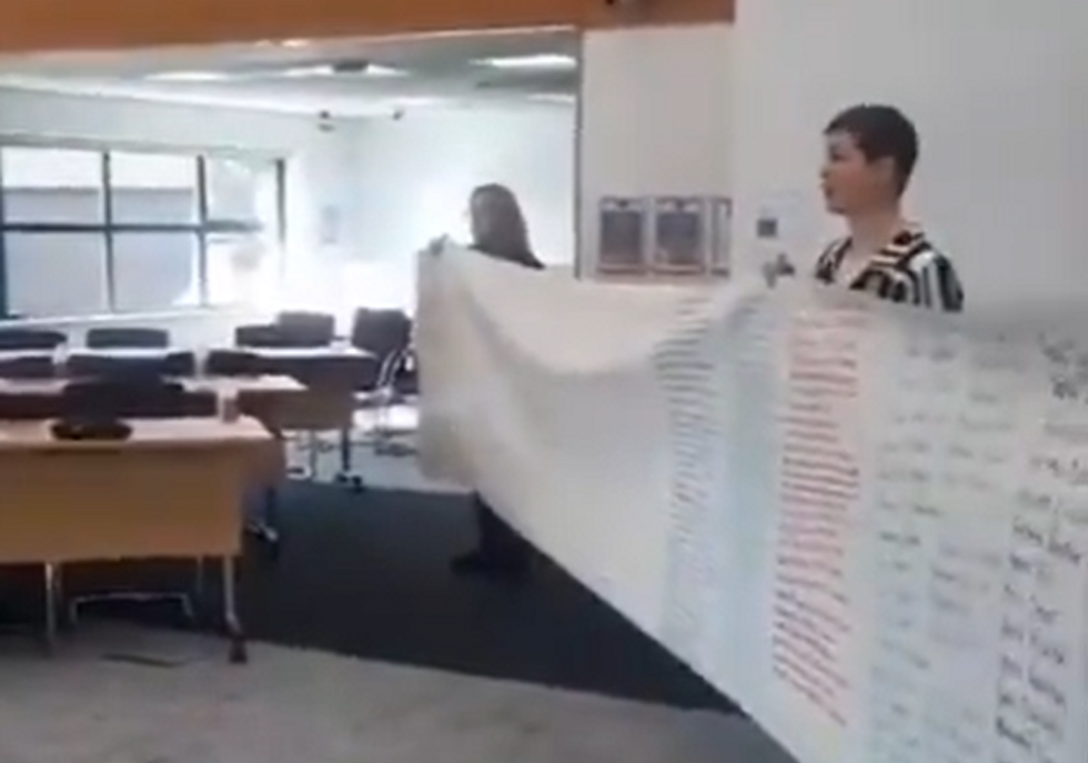 \u200bThe group interrupted the meeting with a banner