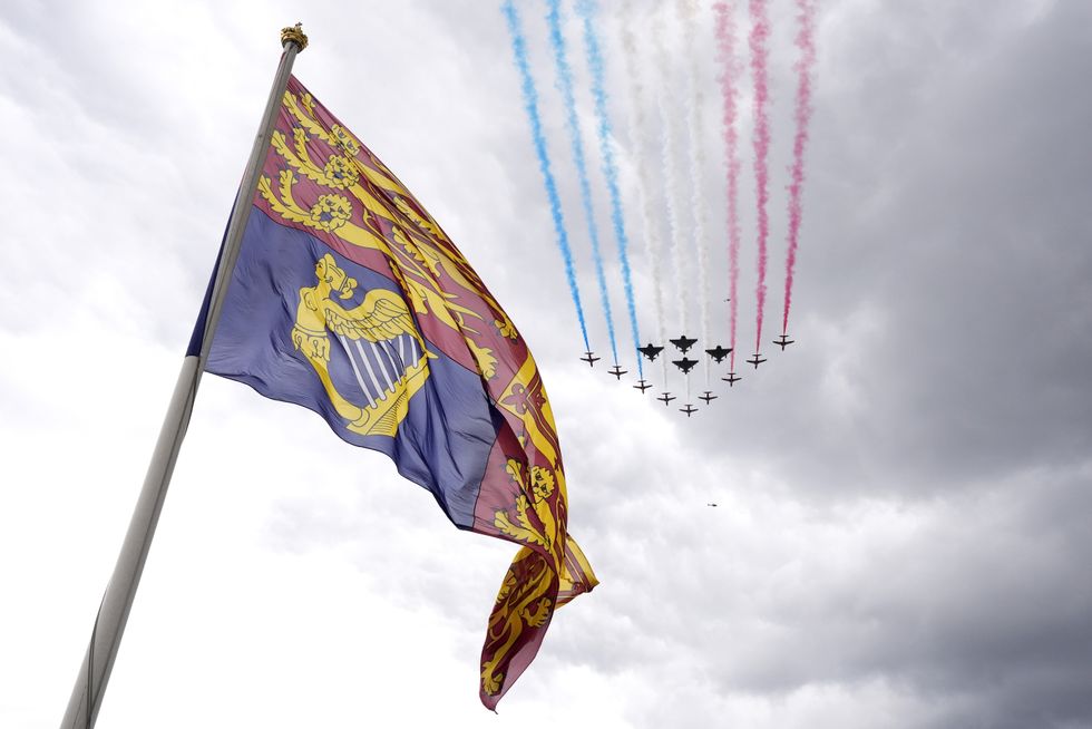 \u200bThe military fly past passes over The Mall and Buckingham Palace