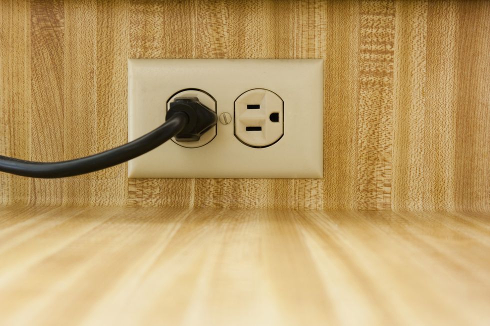 \u200bThe neighbour had used the plug socket (file pic)
