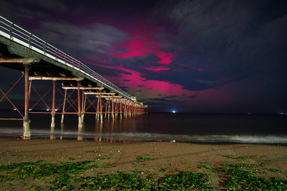 \u200bThe Northern Lights visible through clouds over Saltburn-by-the-Sea in North Yorkshire