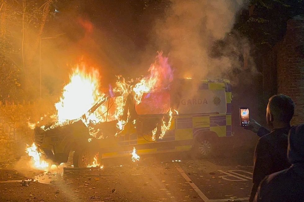 \u200bThe police van was set alight