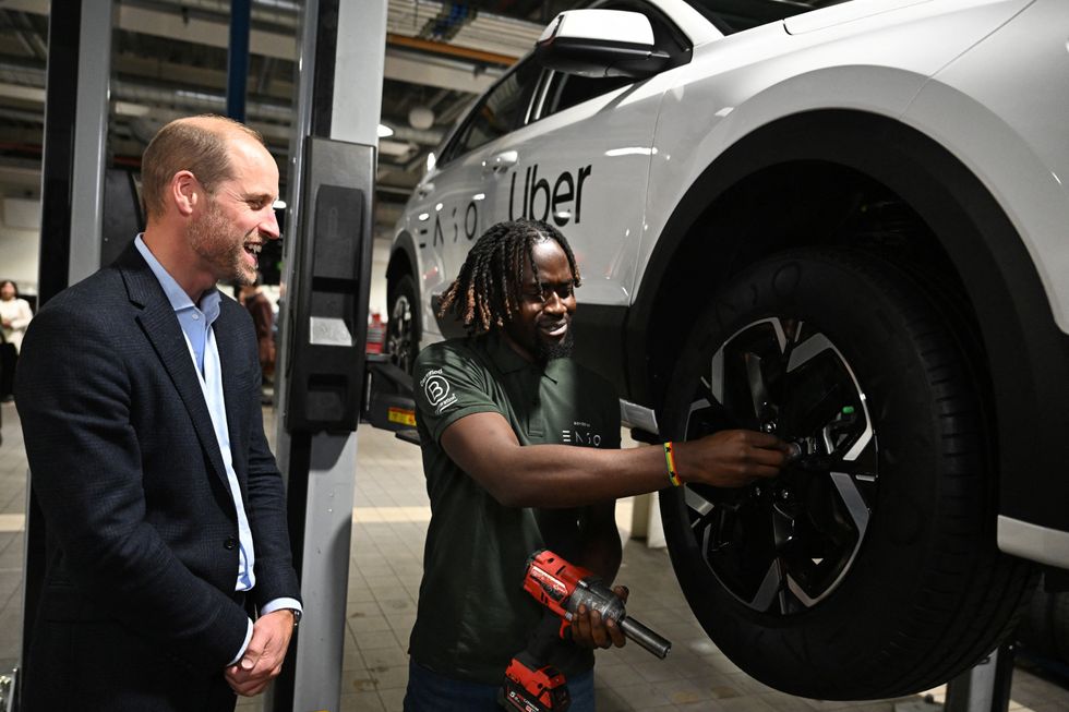 \u200bThe Prince of Wales speaking to a worker during a visit to the 2023 Earthshot Prize Finalist, ENSO, in Brentford