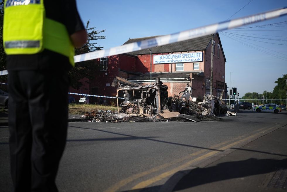 \u200bThe remnants of a burnt out bus in Leeds