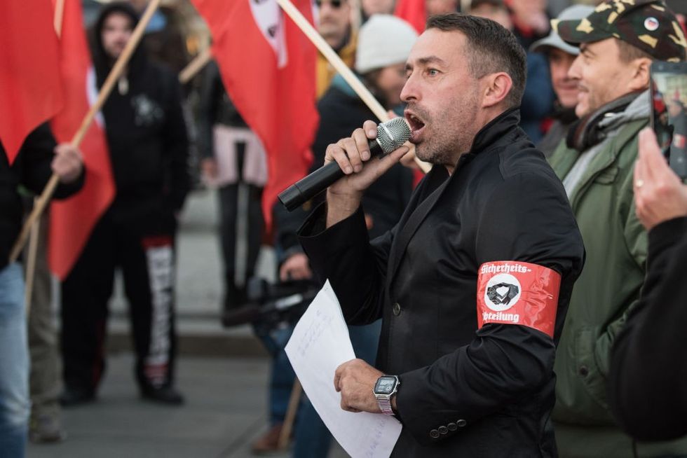 \u200bThe right-wing extremist Sven Liebich seen speaking during a protest against Merkel's visit to Chemnitz, Deutschland