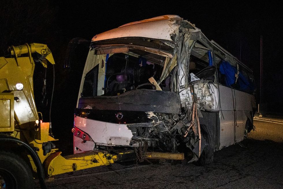 \u200bThe Spanish damaged bus towed by a truck in Porte-Puymorens, southern France