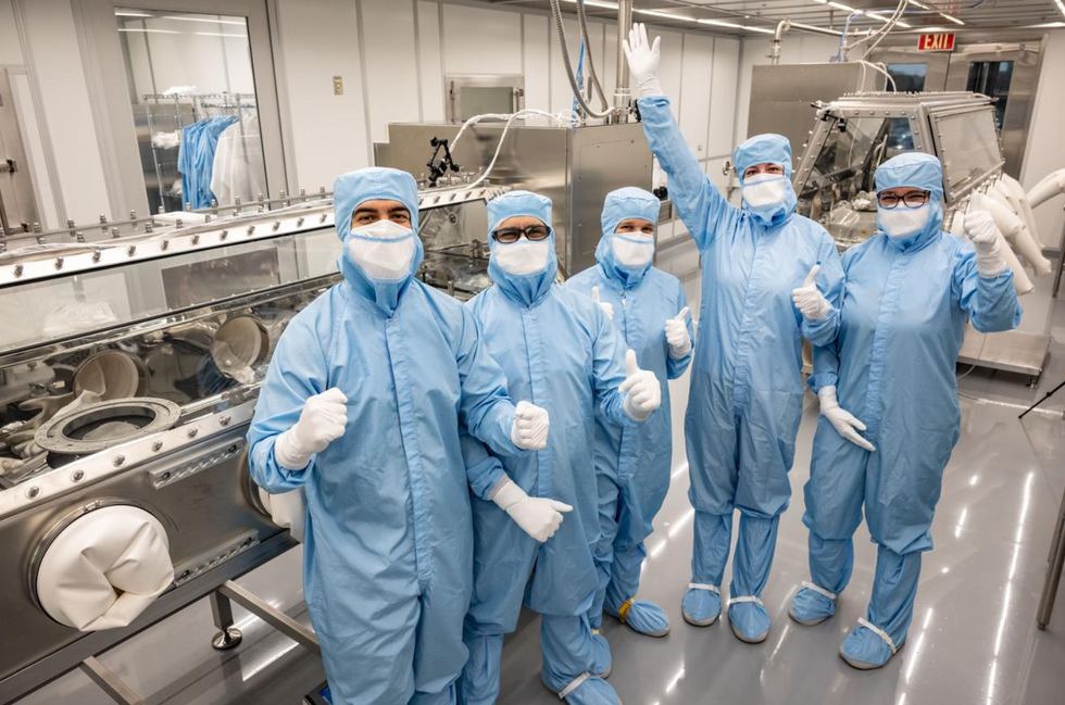 \u200bThe team of scientists celebrate their success