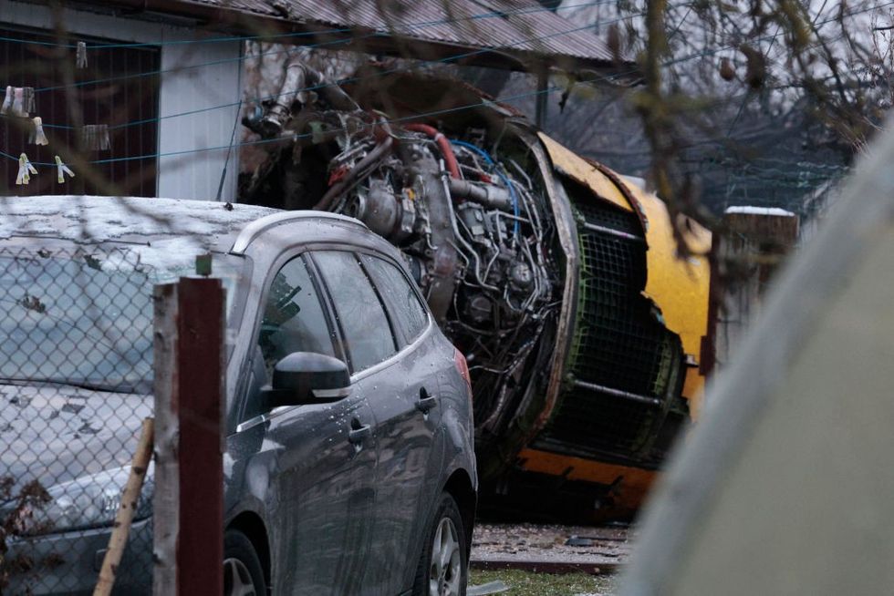 \u200bThe wreckage of a cargo plane in the courtyard of a house following its crash near the Vilnius International Airport in Vilnius.