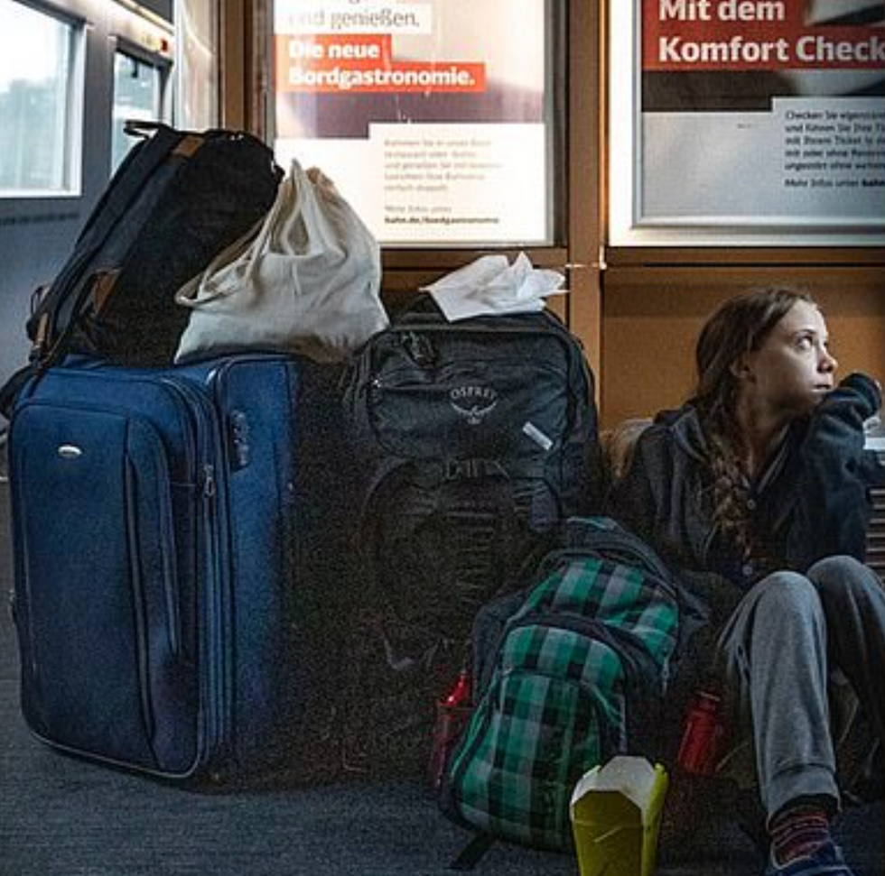 \u200bThunberg tweeted a photo of herself sitting on the floor of a train next to her bags