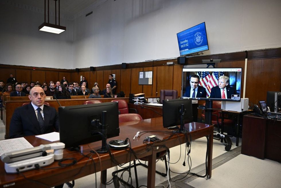 \u200bTrump attorney Emil Bove looks on as US President-elect Donald Trump appears remotely for a sentencing hearing