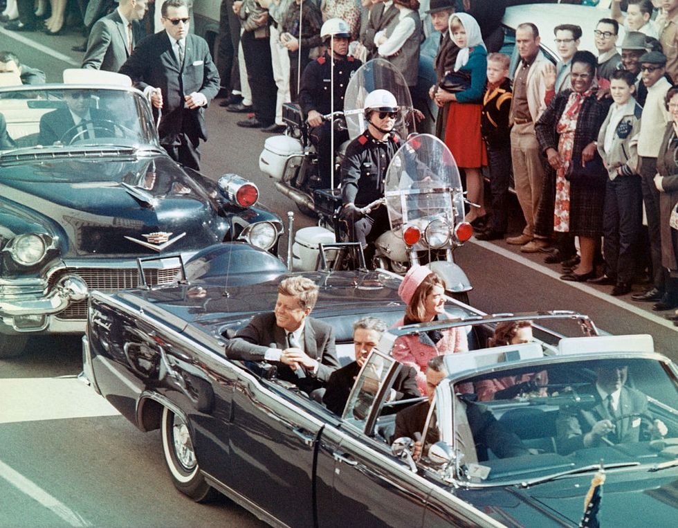 \u200bUS President John F Kennedy, First Lady Jacqueline Kennedy, Texas Governor John Connally, and others smile at the crowds