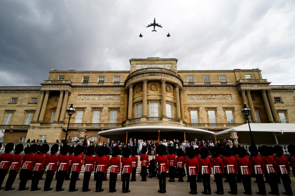 \u200bVeterans and members of the armed forces on the West Terrace in the gardens of Buckingham Palace