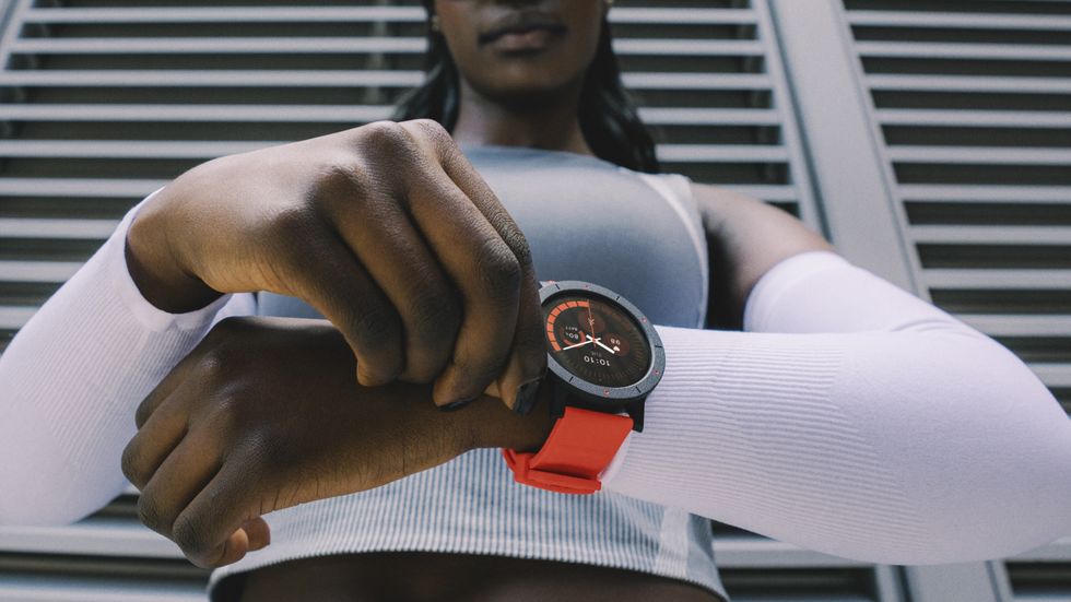 \u200bWatch 3 Pro in black and orange colourway on someone's wrist