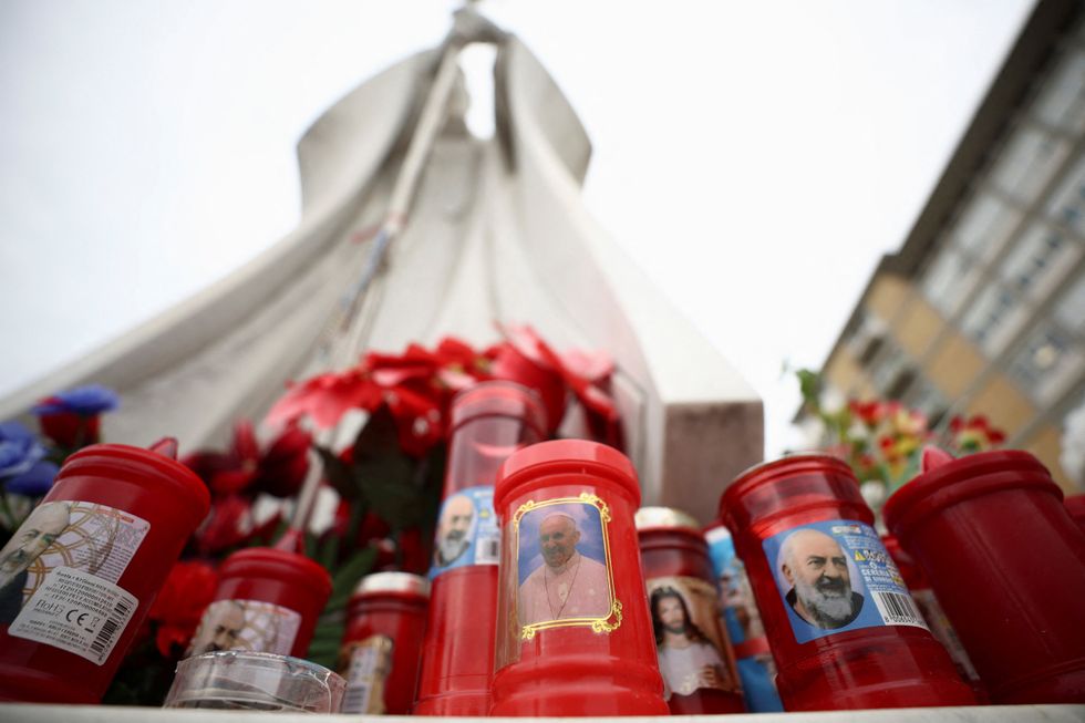 \u200bWell-wishers lit candles outside the hospital