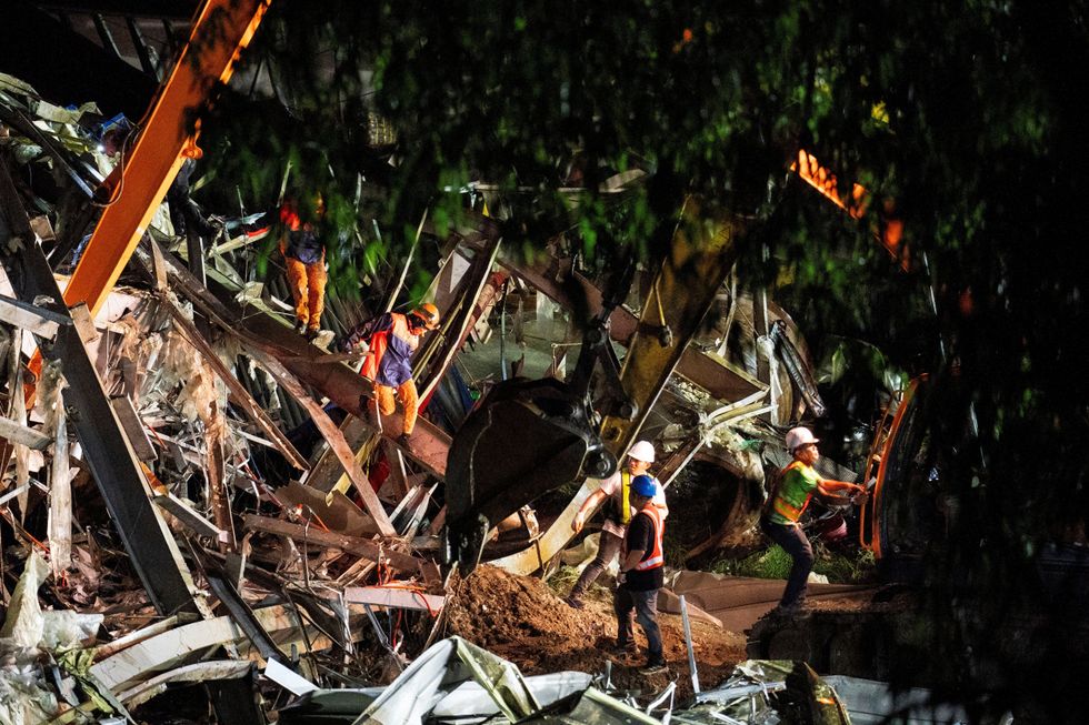 \u200bWorkers conduct a rescue operation at the collapsed landfill in Binaliw, Cebu, Philippines