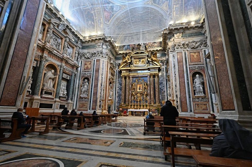 \u200bWorshippers pray in the Pauline Chapel,