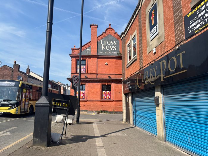 \u201cVote Andy\u201d posters placed in the windows of a derelict pub in Ashton-in-Makerfield