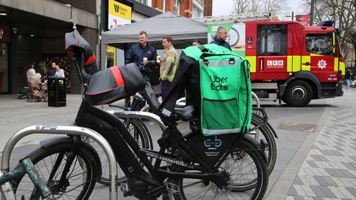 Uber Eats bike and fire brigade