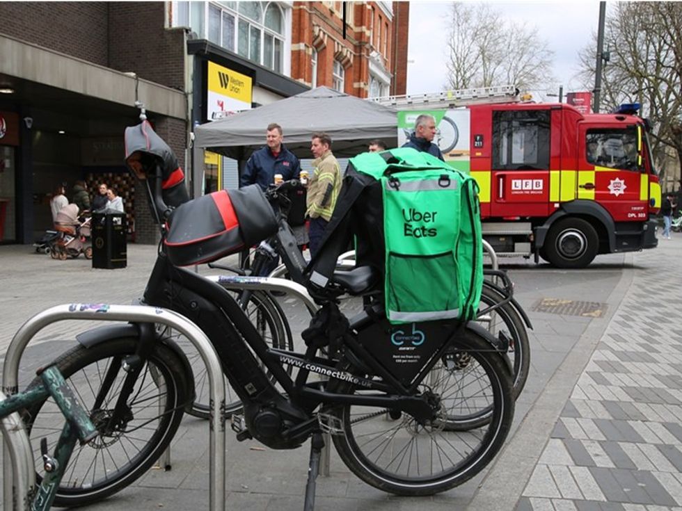 Uber Eats bike and fire brigade