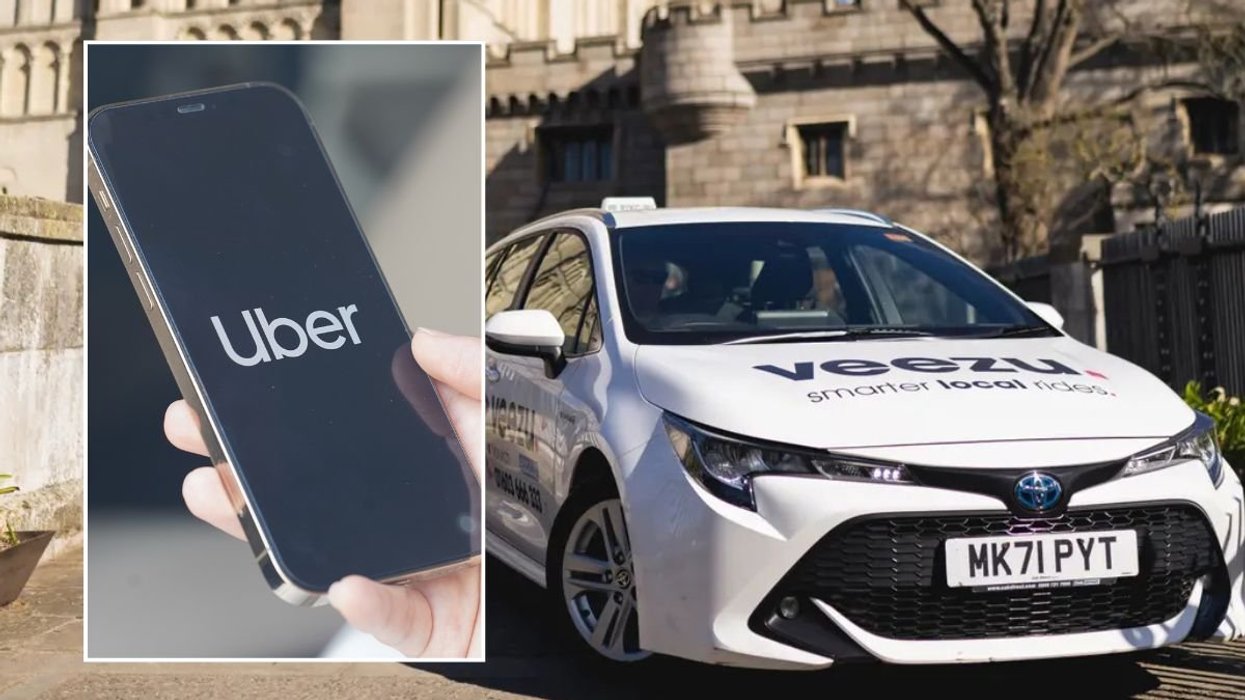 Uber logo and a Veezu car