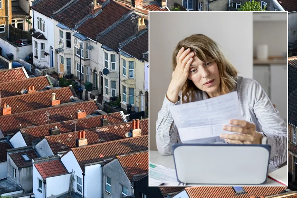 UK houses / woman stressed looking at document