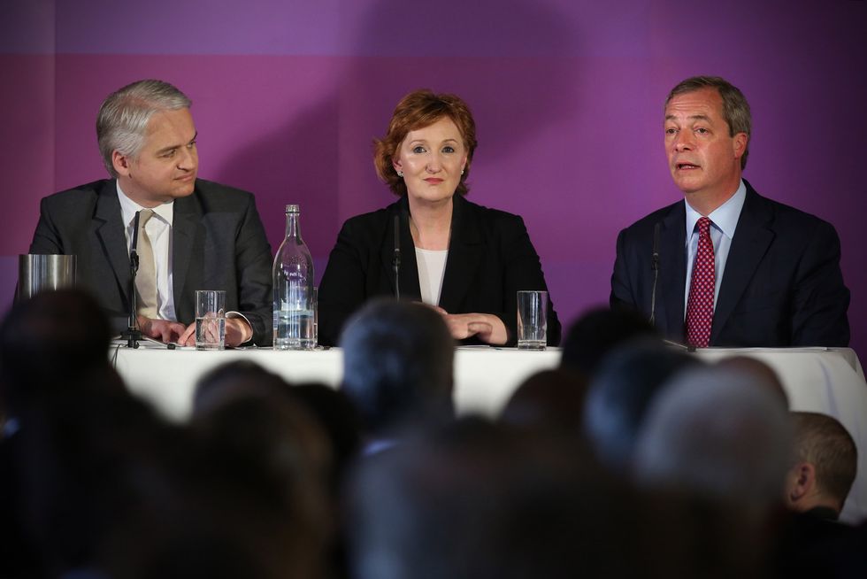 UK Independence Party (UKIP) leader Nigel Farage (R) speaks as deputy chairwoman Suzanne Evans (C) and MEP Patrick O'Flynn (L)