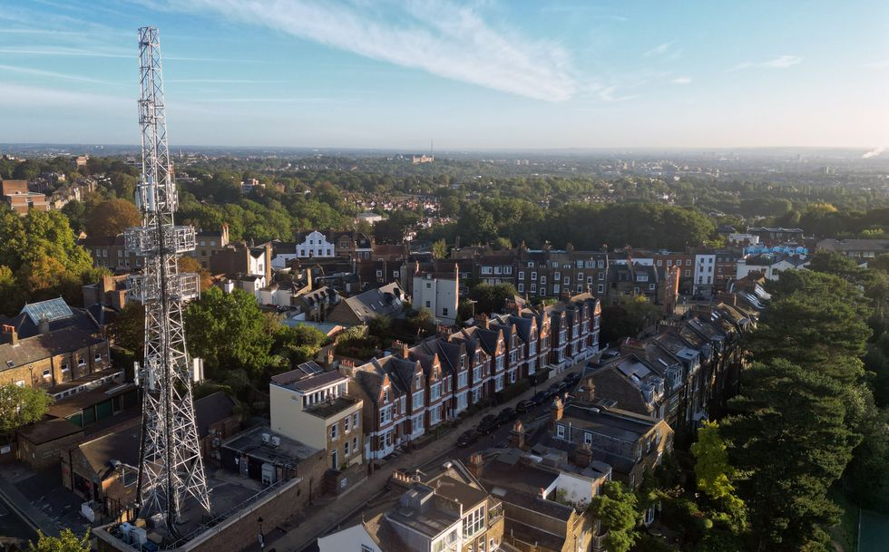 UK mobile network aerial pictured at the end of a row of residential houses