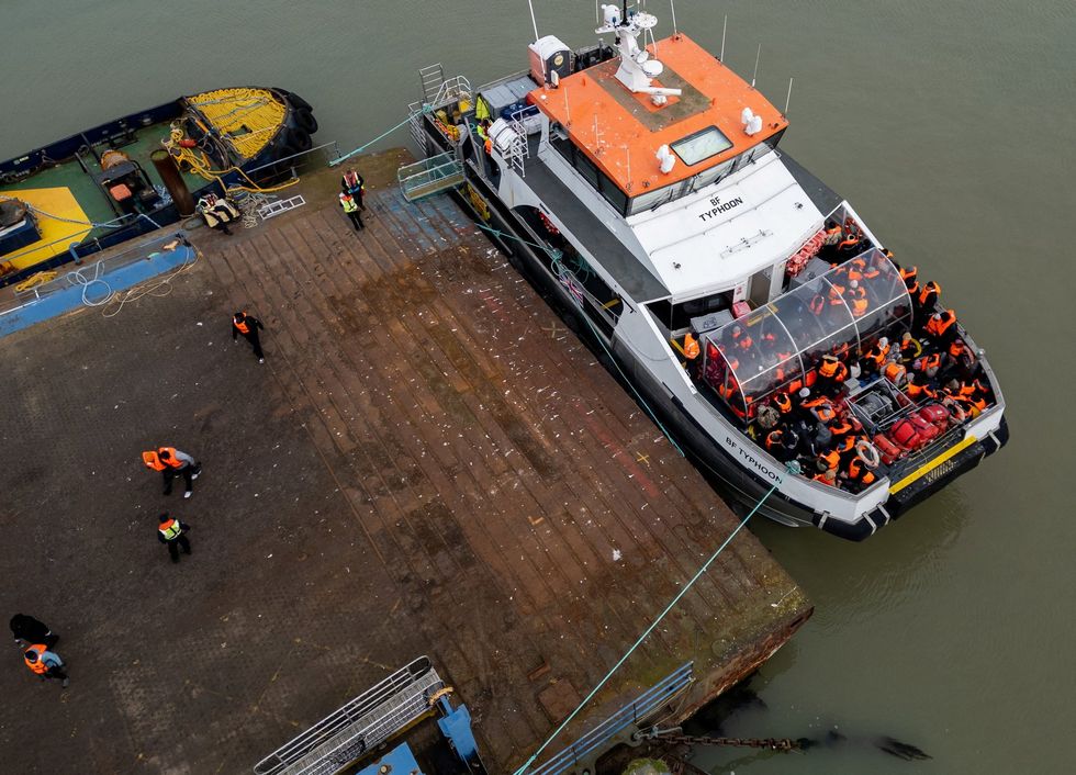 UK vessel brings migrants over from France