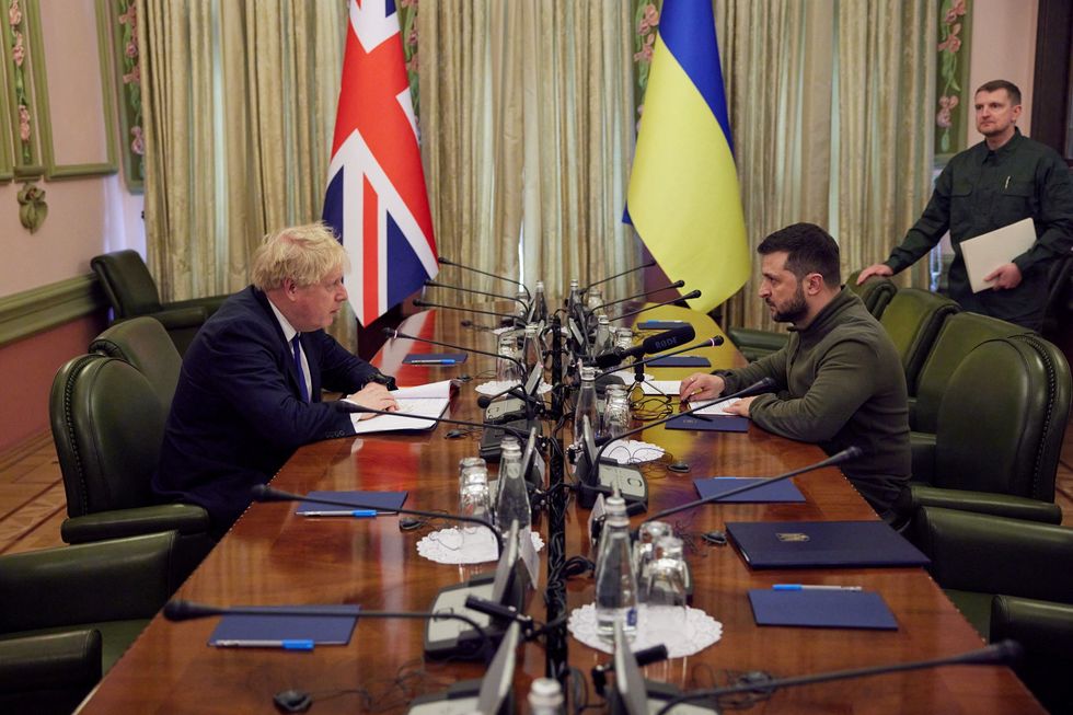 Ukraine's President Volodymyr Zelenskiy and British Prime Minister Boris Johnson attend a meeting, as Russia's assault on Ukraine goes on.